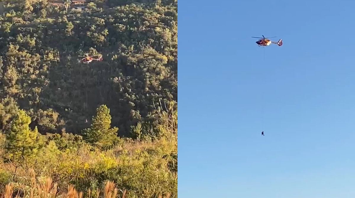 helicóptero resgatando mulher